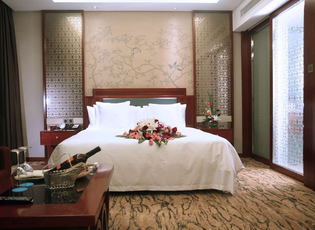 Gloria Grand Hotel Wuxi وكسي الغرفة الصورة